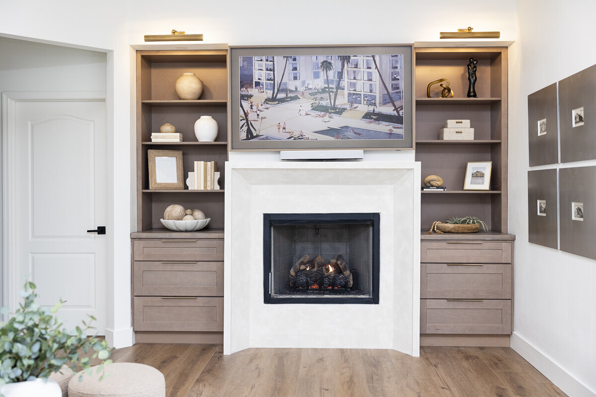 dewine design orlando interior designer belle isle living room fireplace with framed tv and buildin shelfs