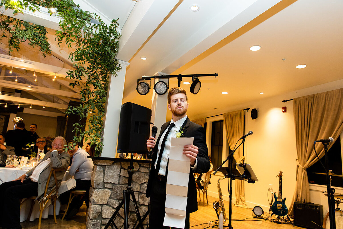 Groomsman toast in pavilion at Roche Harbor Resort
