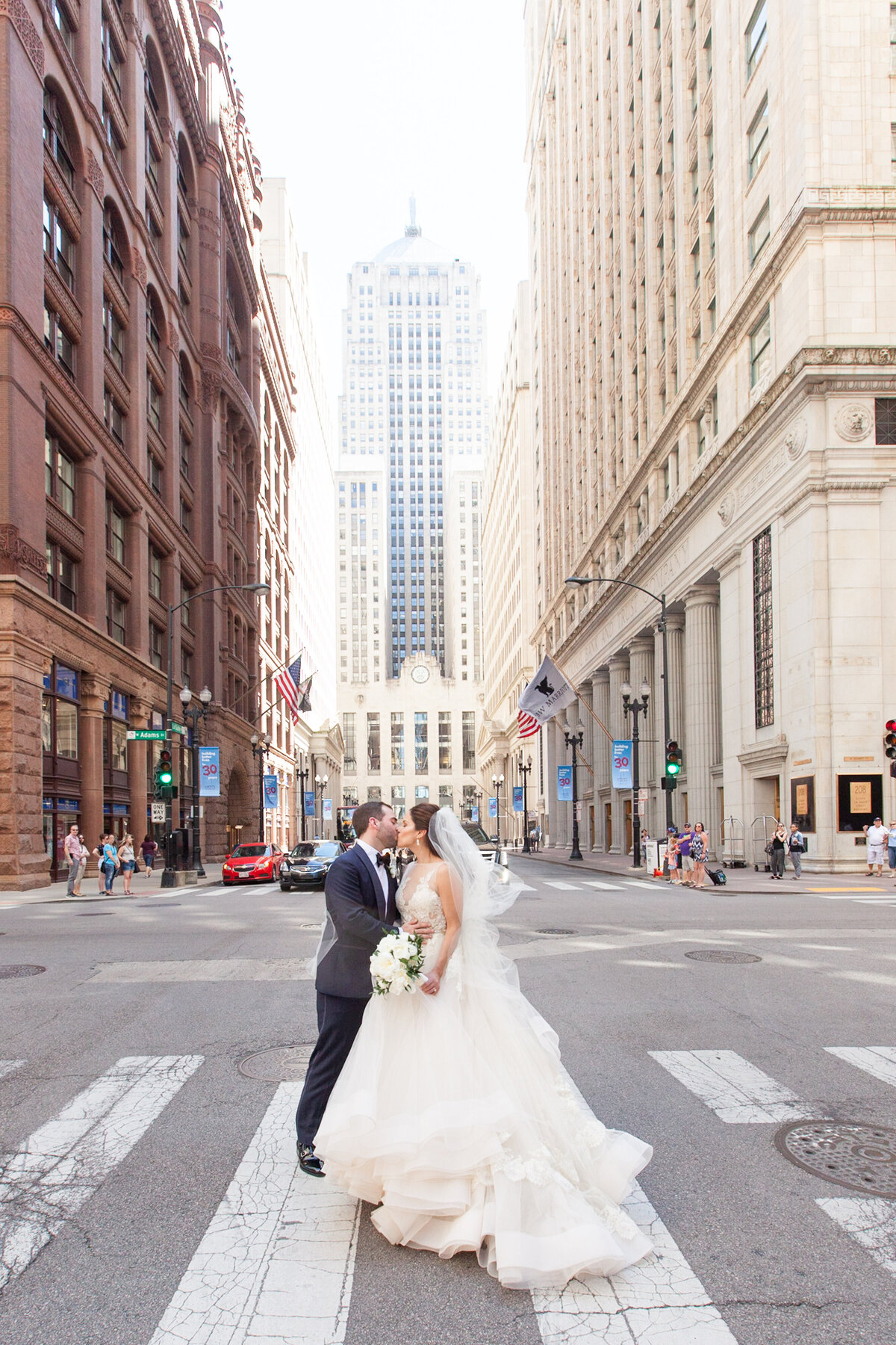 bride and groom on Lasalle street in Chicago