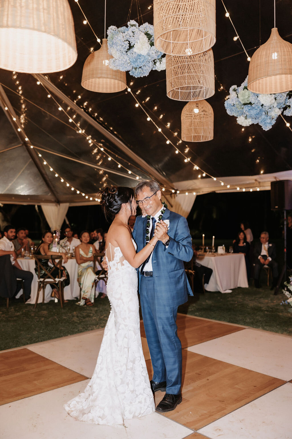 father daughter dance under lantern installation on checkered dance floor