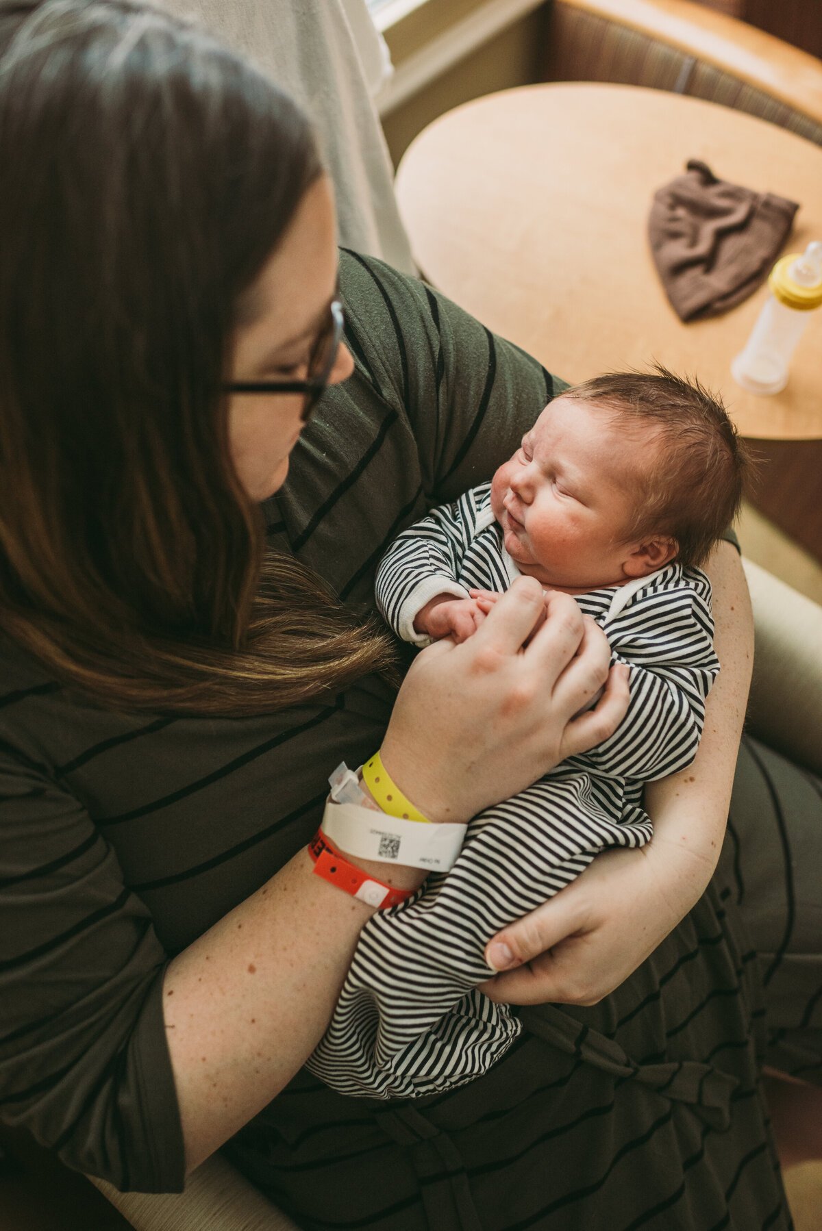 mother holding fresh48 newborn