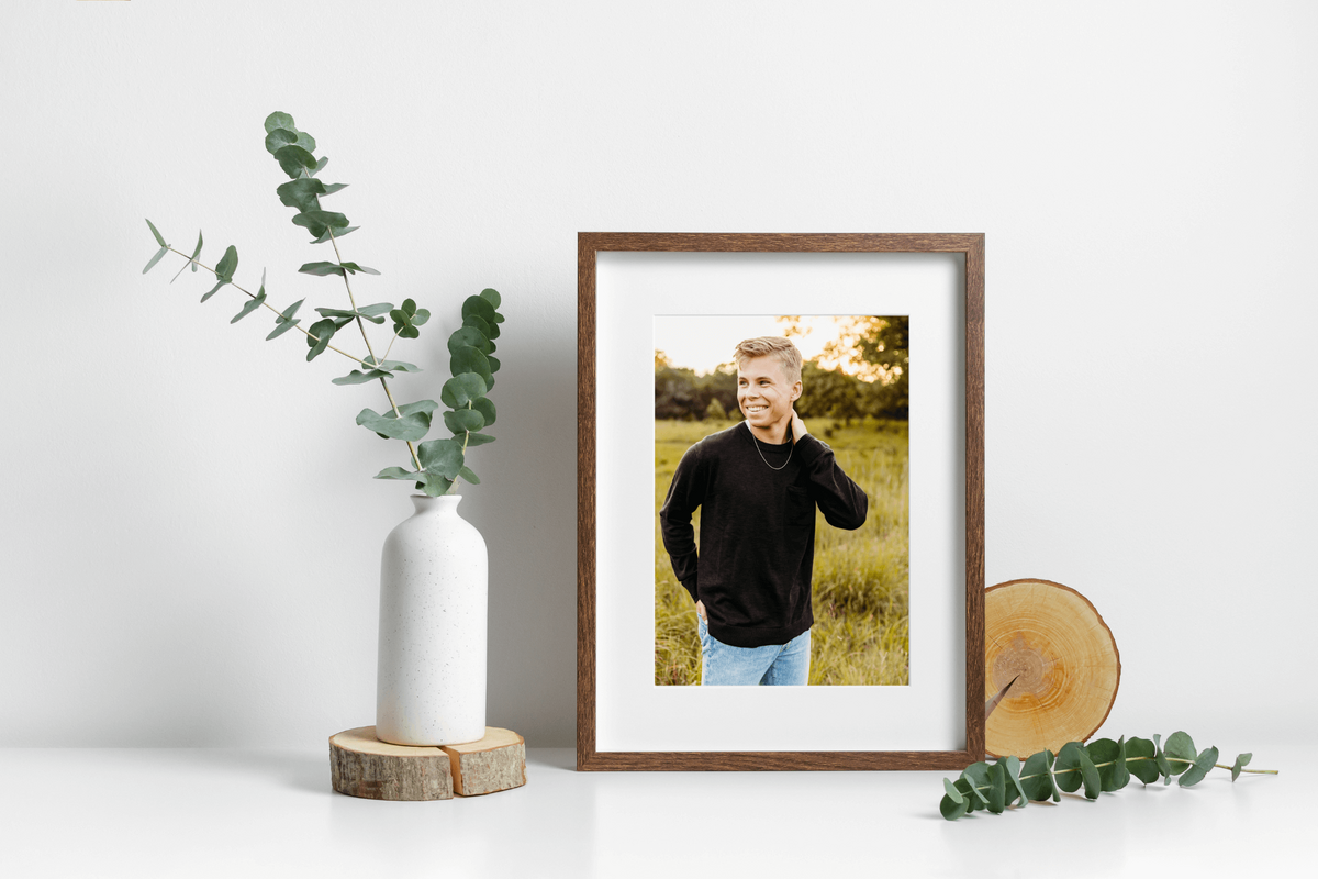image of senior boy displayed in a wooden frame