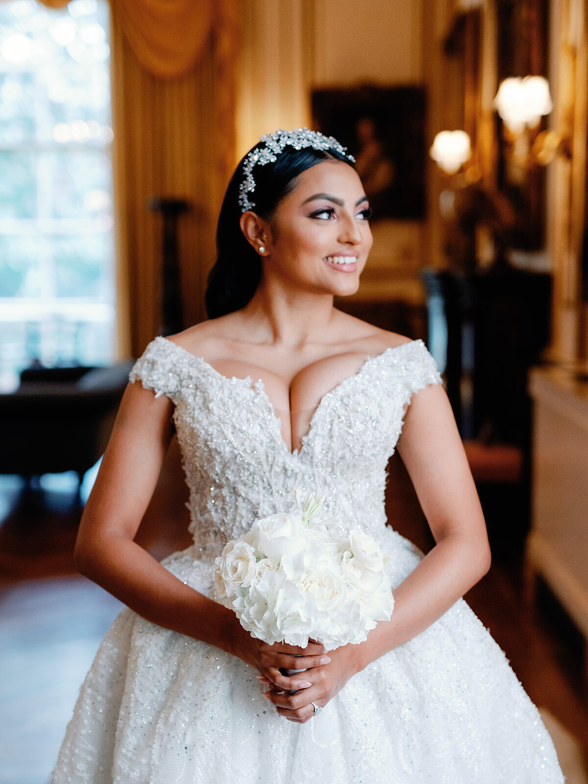 Bride looking out towards the window light