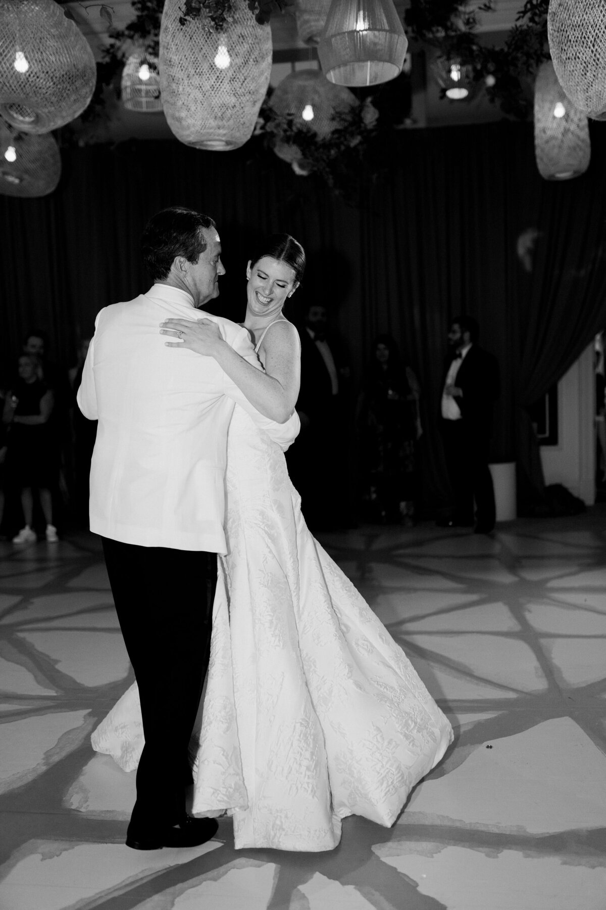 Black and white photo of the bride and groom on the dance floor. 