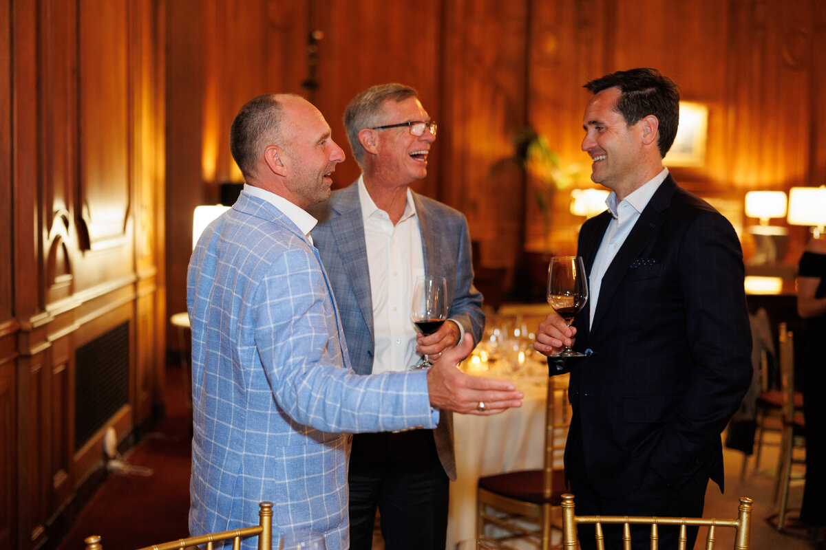 three males smiling