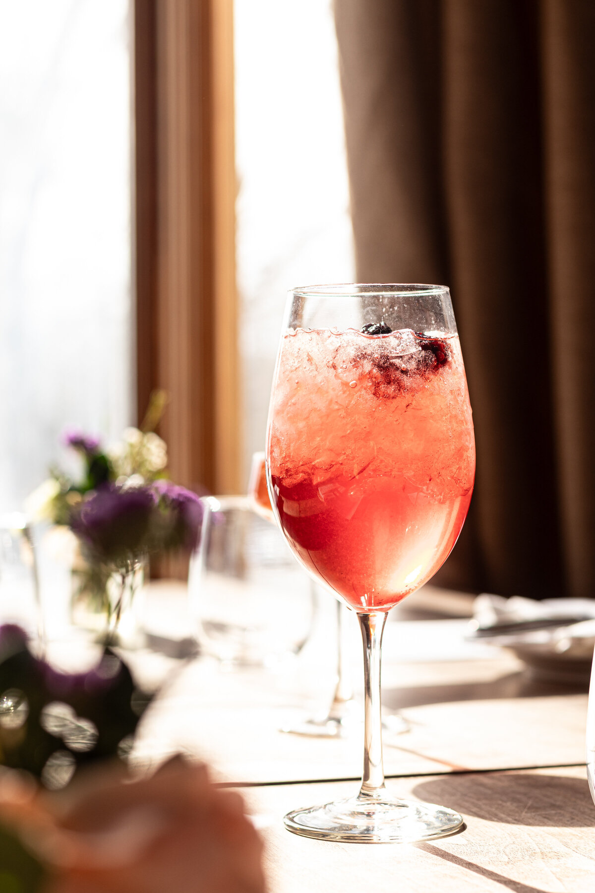 a cocktail in a wine glass