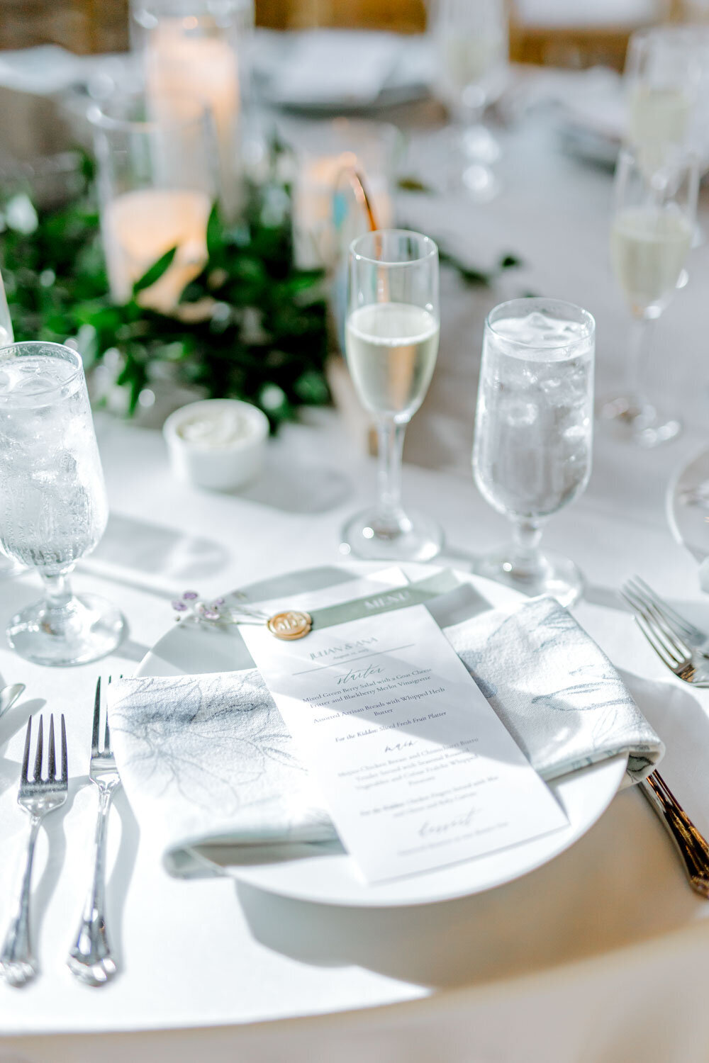 Wedding table setting with menu and champagne glasses