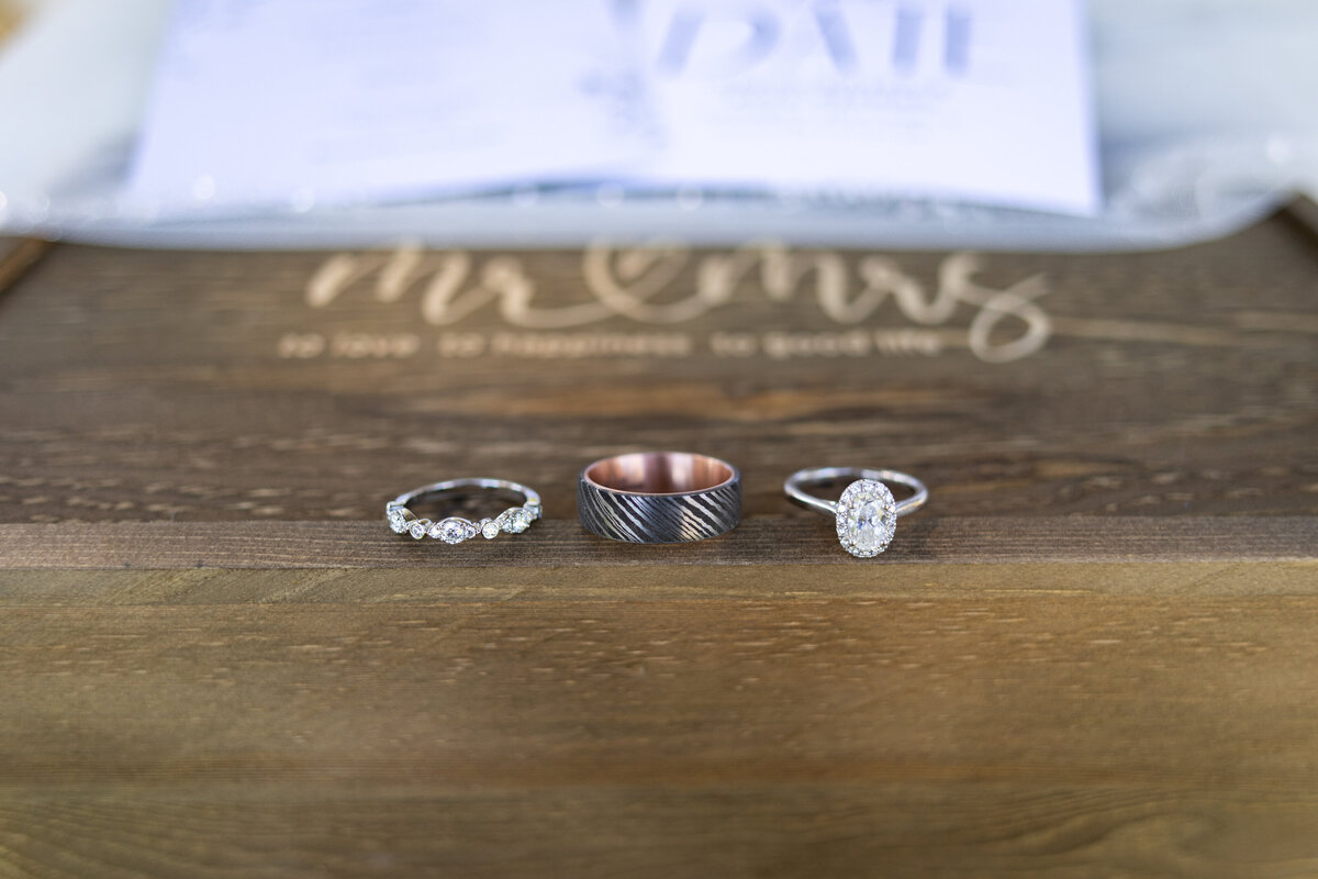 Bride and Groom wedding and engagement rings flatlay