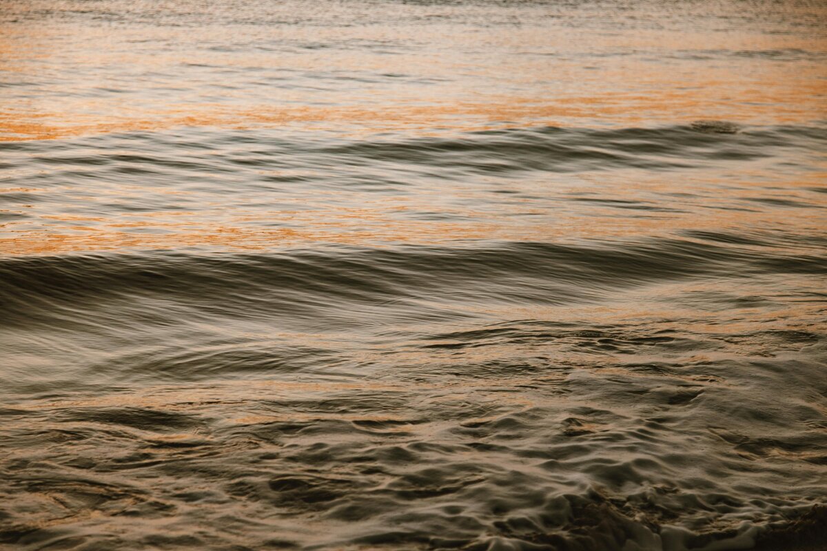 close up of waves at sunset