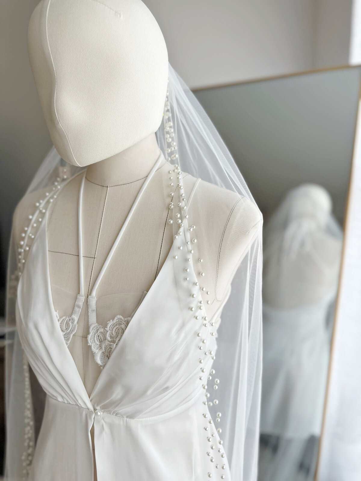 Close-up view of beaded edge on single-layer bridal veil
