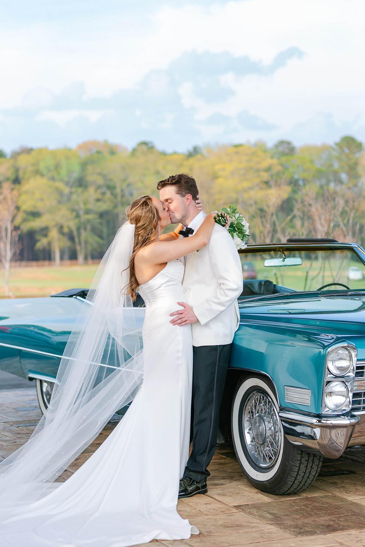 Newlywed couple with getaway car | Alabama wedding photographer Amanda Horne