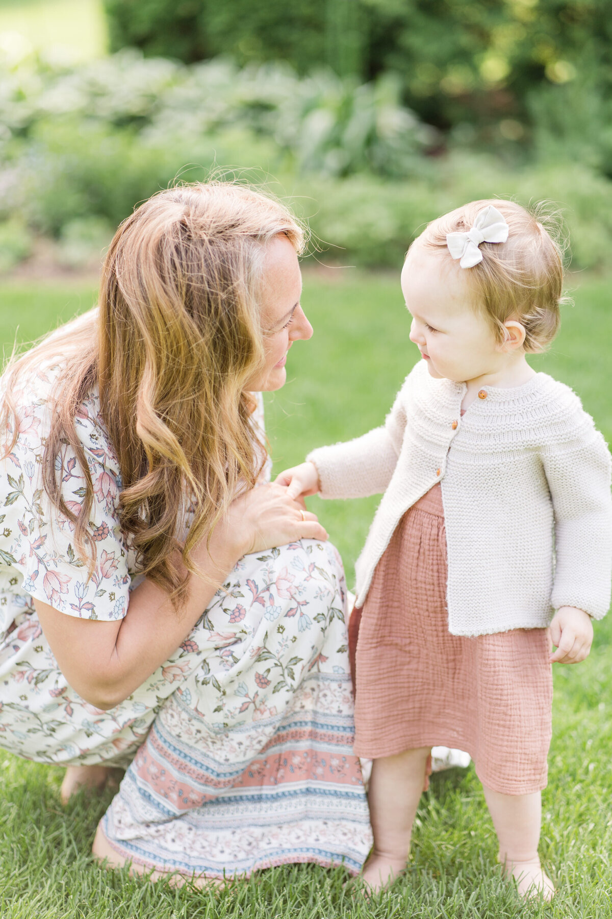 mother and daughter face to face in an outdoor  minneapolis session
