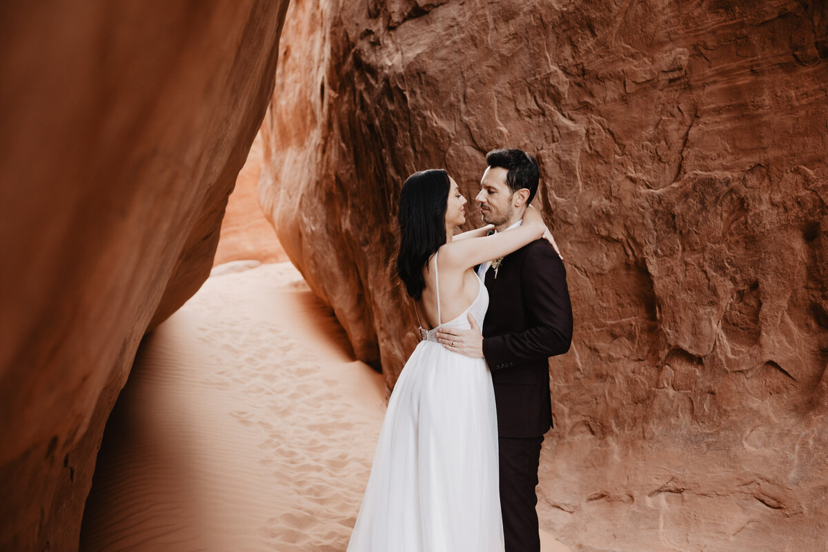 Utah elopement photographer captures bride's arms around groom's neck