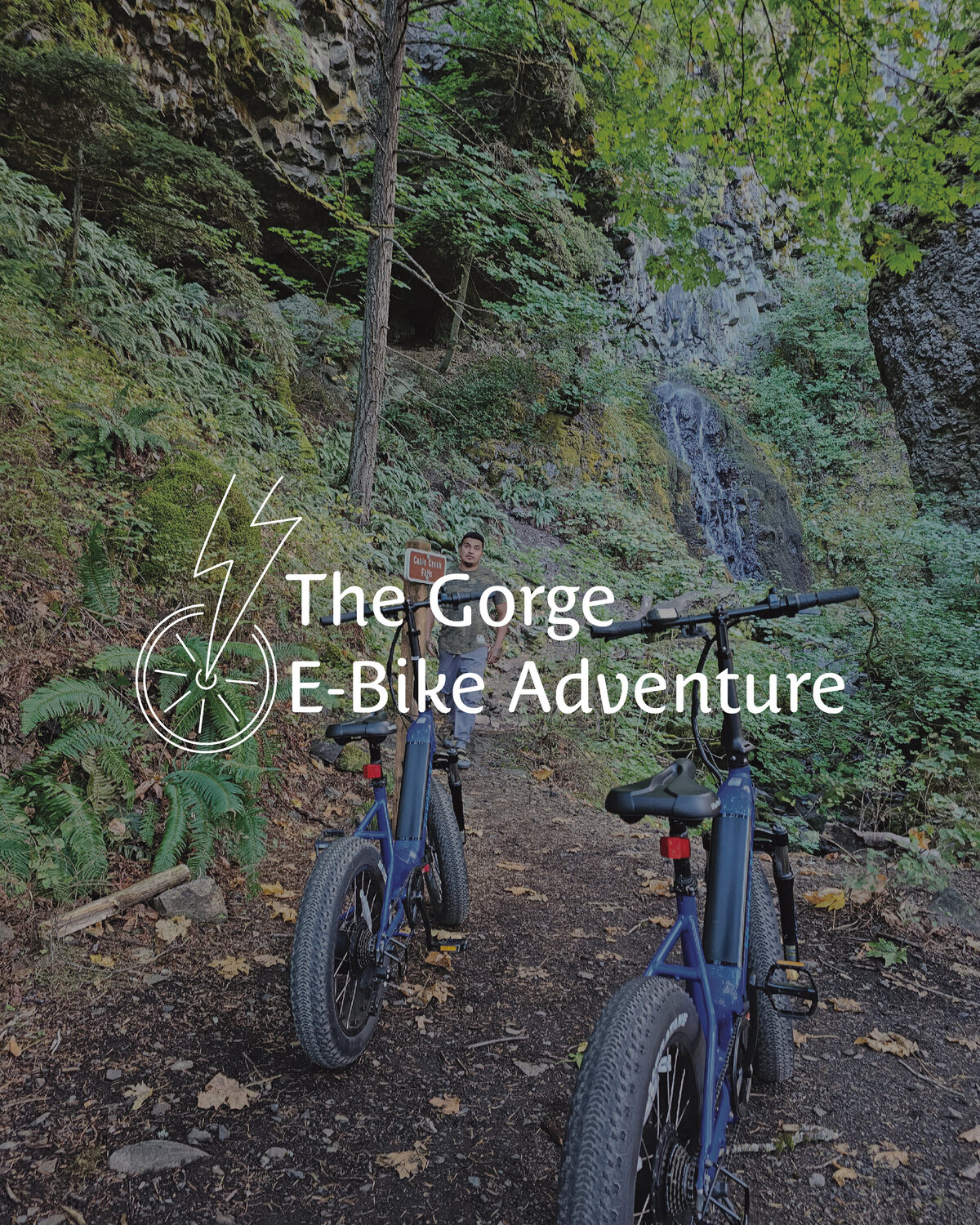 The Gorge E-Bike Adventure Rentals logo layered on top of an image of a man standing in nature with a couple of electric bikes