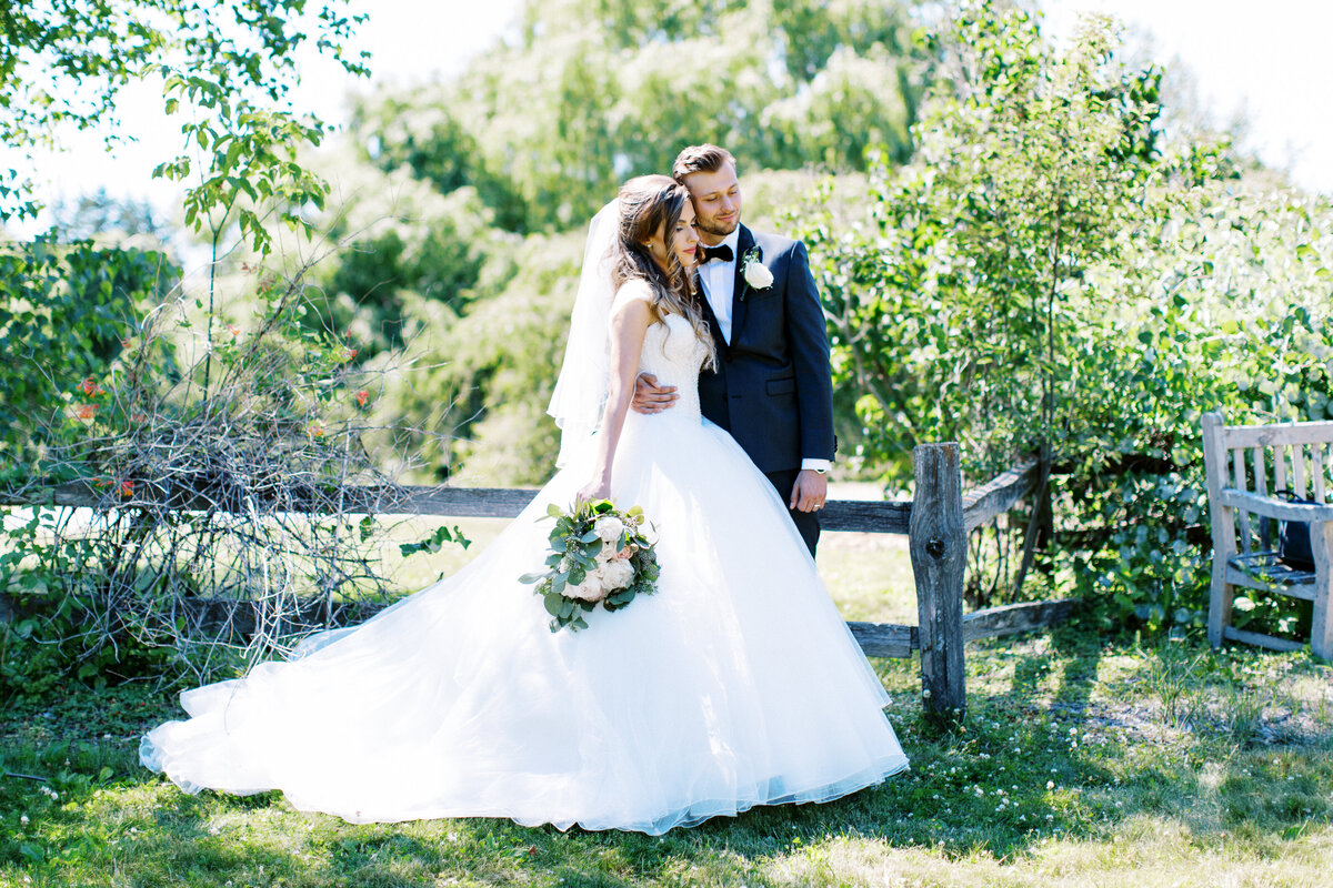 Bride and groom holding each other in the moment