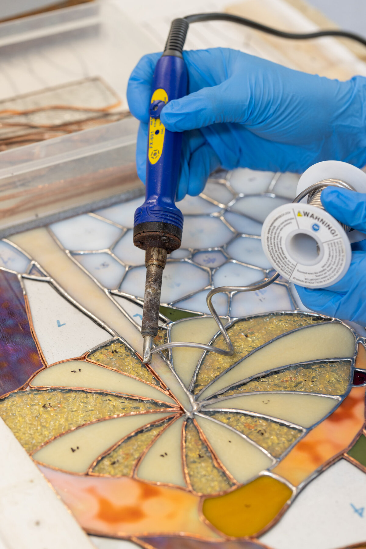 nj-brand-photography-Stained-Glass-Artist-soldering