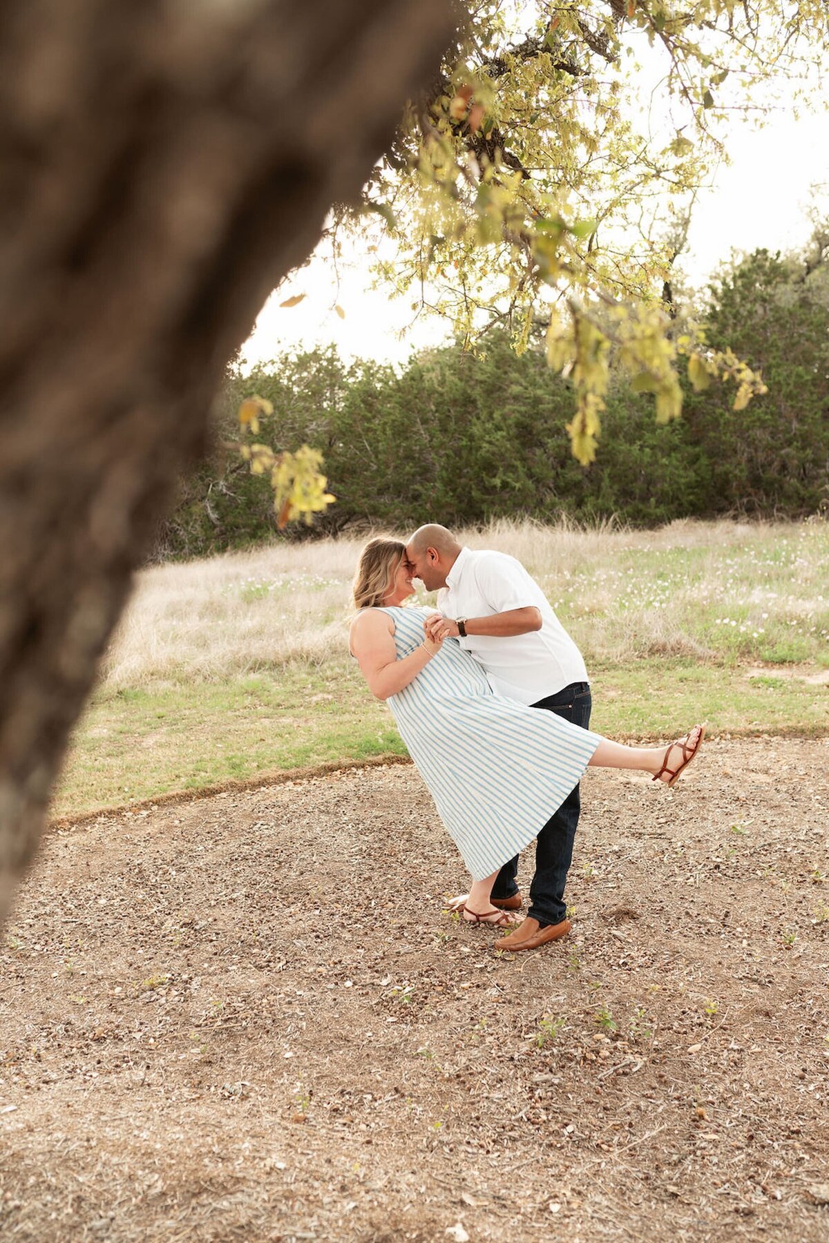 jen and miguel embracing during engagment photos