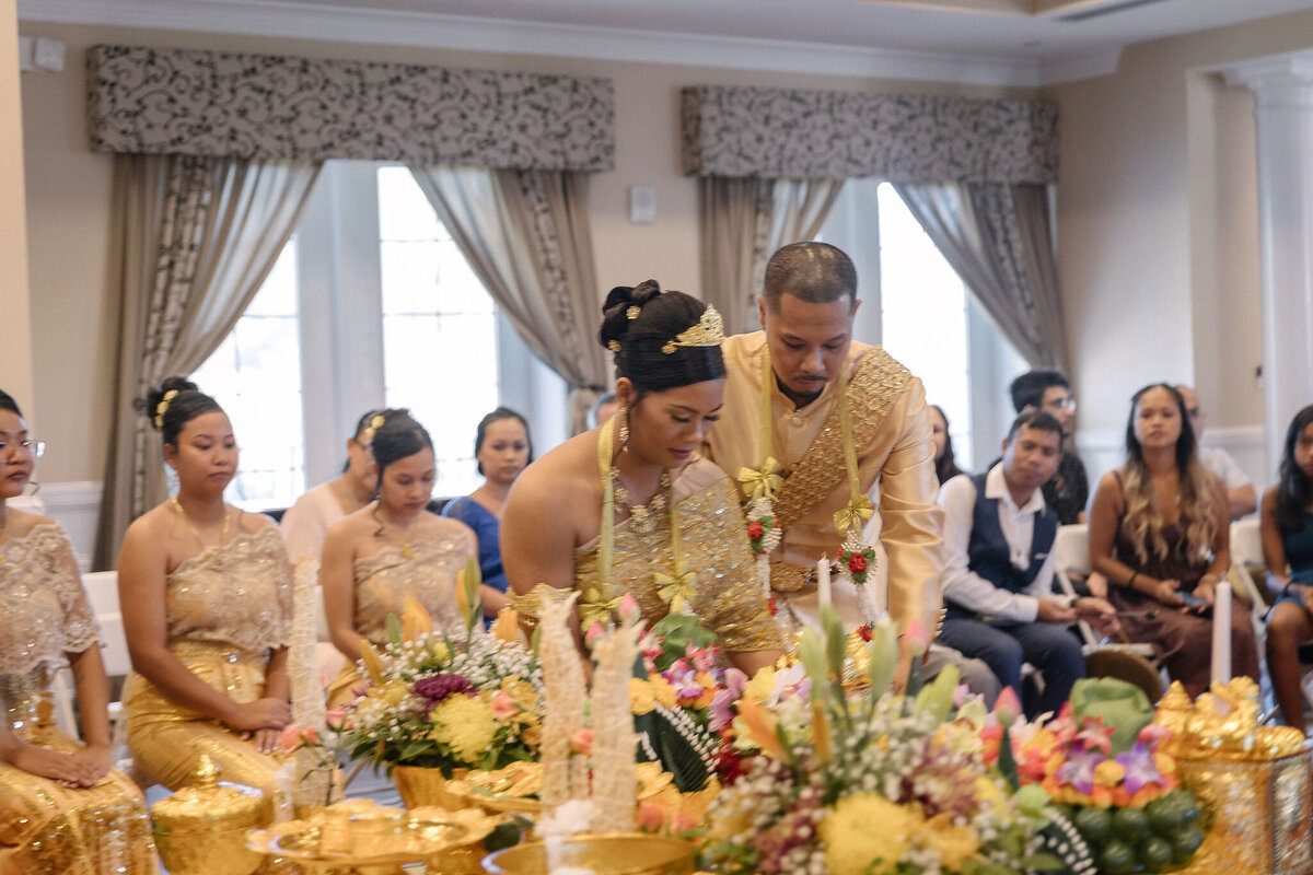 Bride and groom in Gold at Traditional Khmer Wedding in Jacksonville, FL | Khmer Wedding Photography | Phavy Photography, Cambodian Wedding Photographer