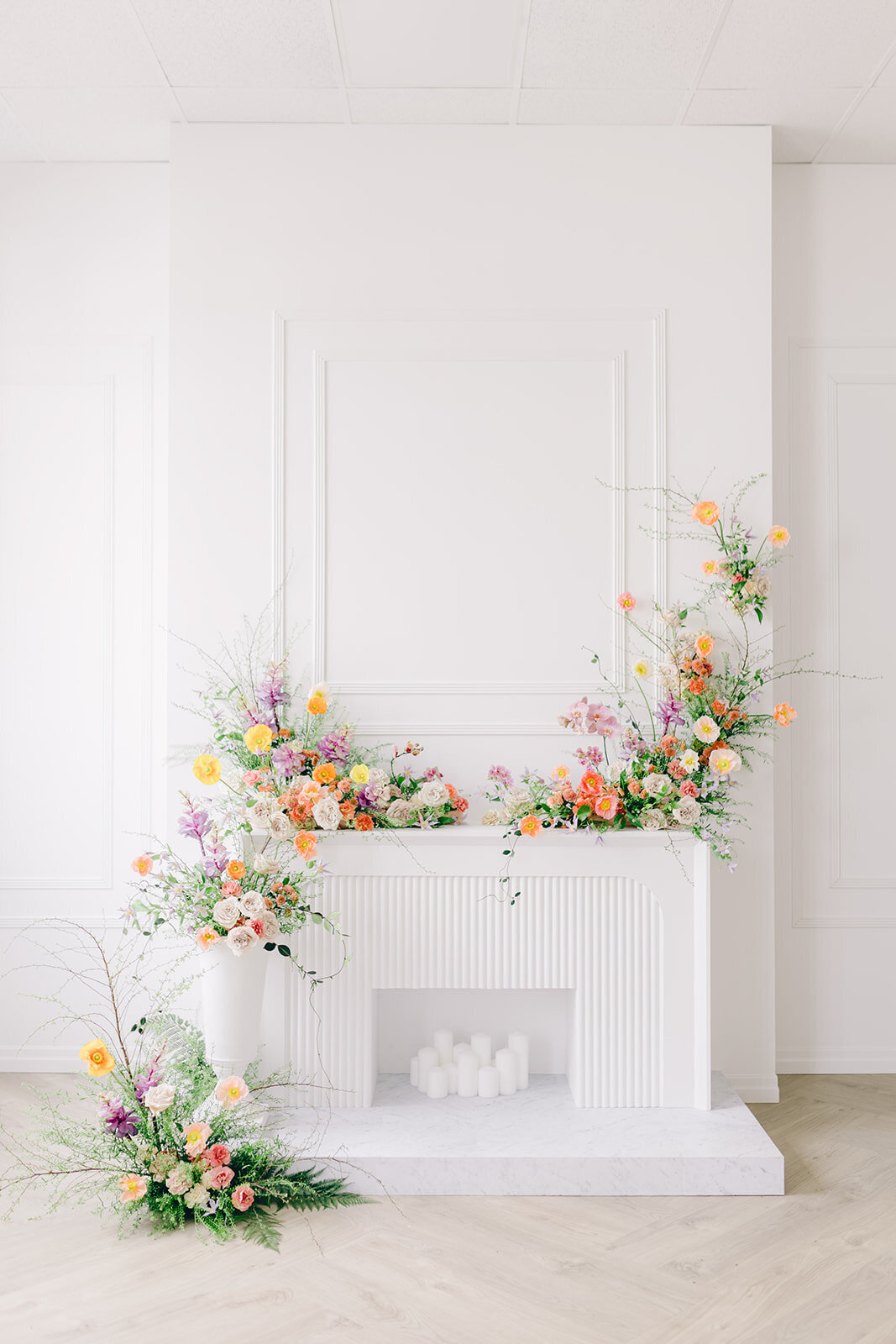 Ceremony arrangements of bright, pastel spring flowers at a Montreal wedding.