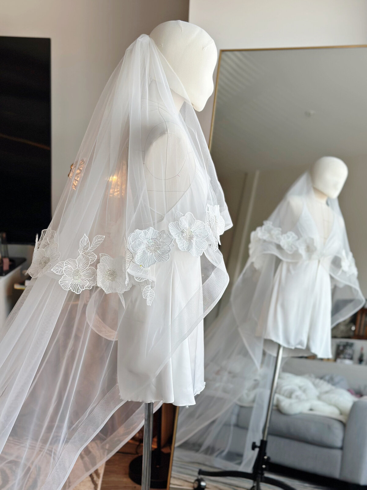 Blusher veil featuring lace border and soft tulle drape
