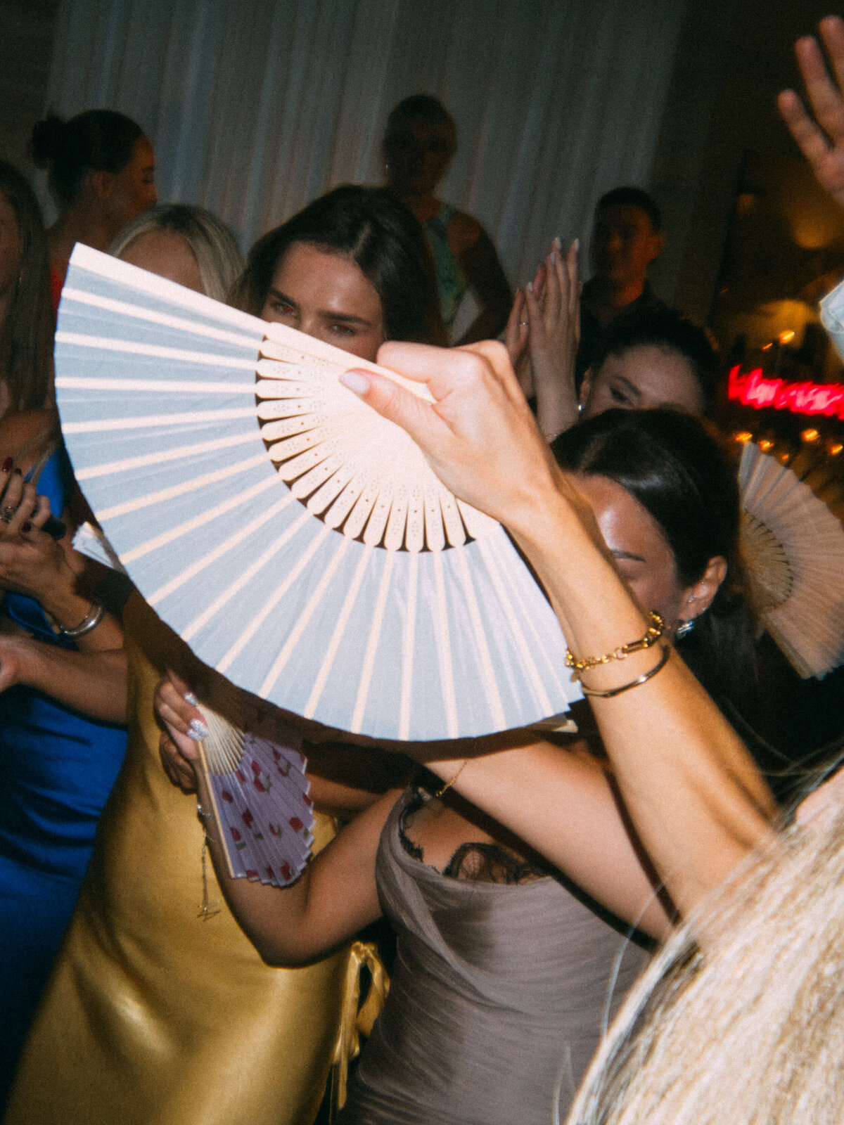 Guests raising glasses in lively celebration at Rome wedding

