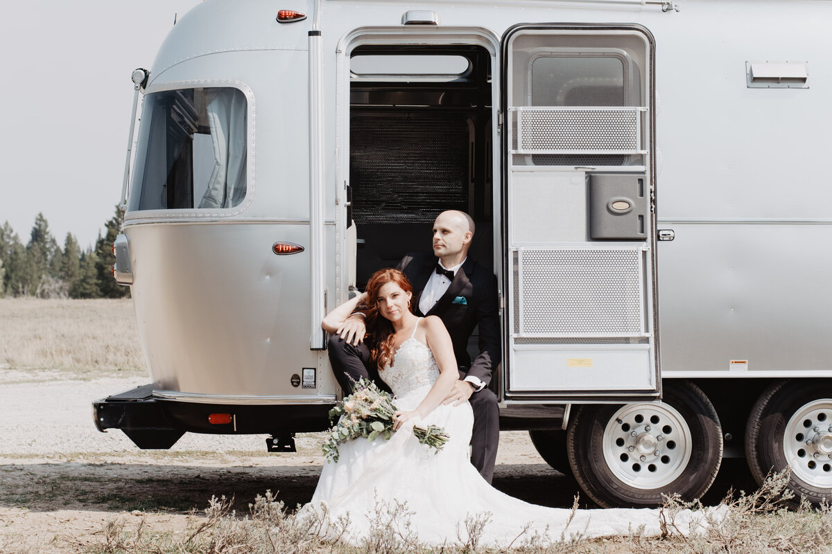 Jackson Hole photographers capture bride and groom sitting together on rv