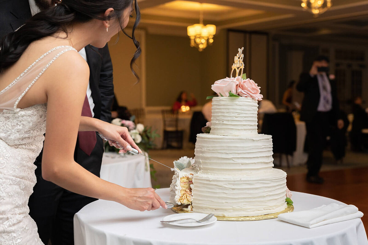 bride and groom cutting cake at Regency