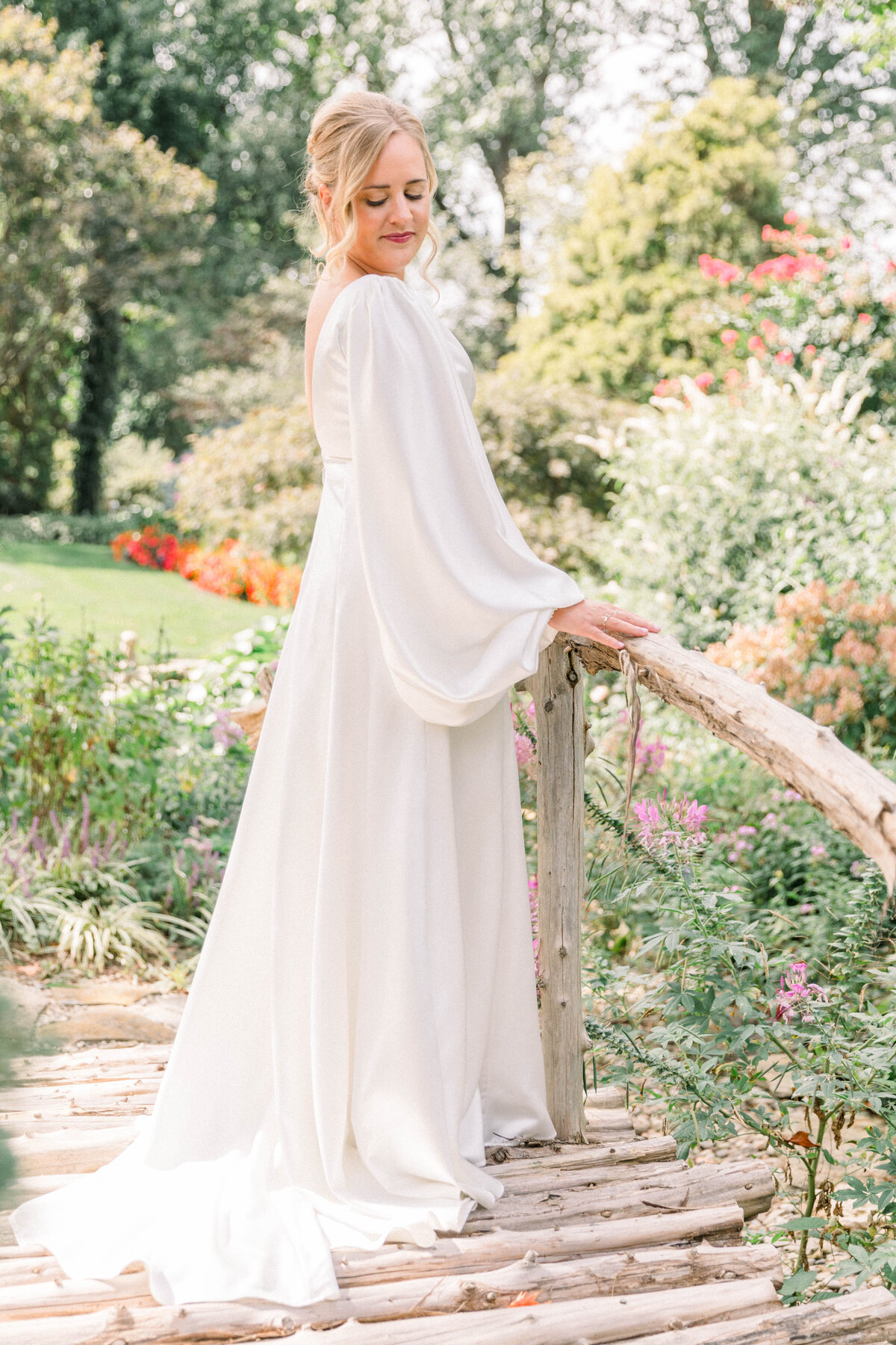 elegant photos of a bride on a bridge