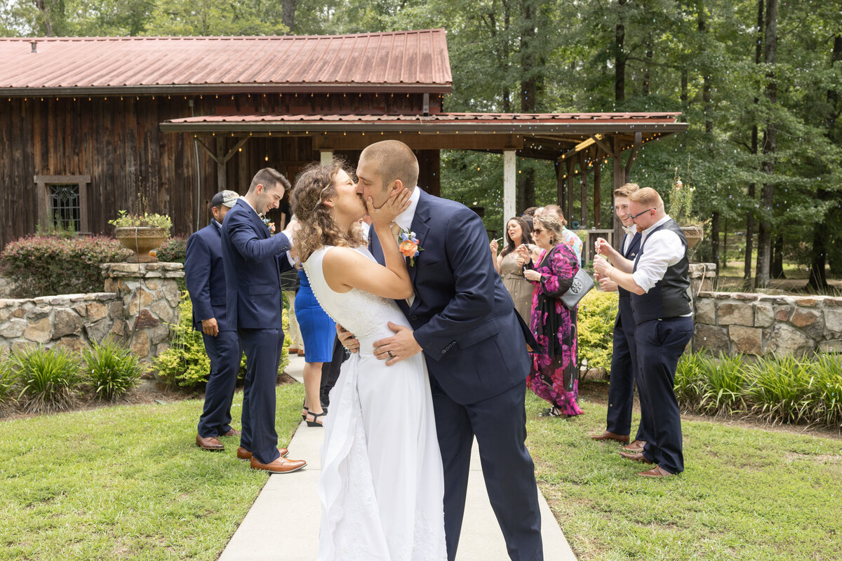 bride-and-groom-kissing-at-Lake-Pines-Event-Center-Midland-Georgia