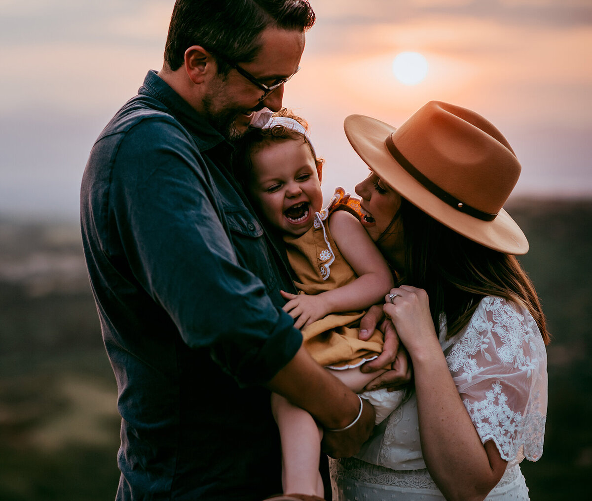 family-in-the-mountains-at-sunset