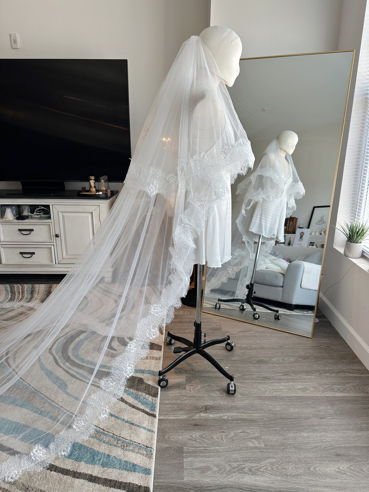 Ivory blusher veil attached to silver comb for secure fit
