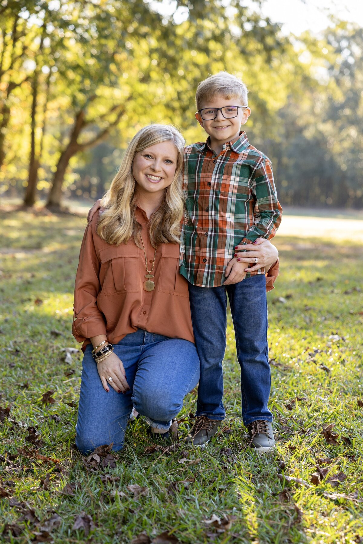 mom and son posing for fall family photo