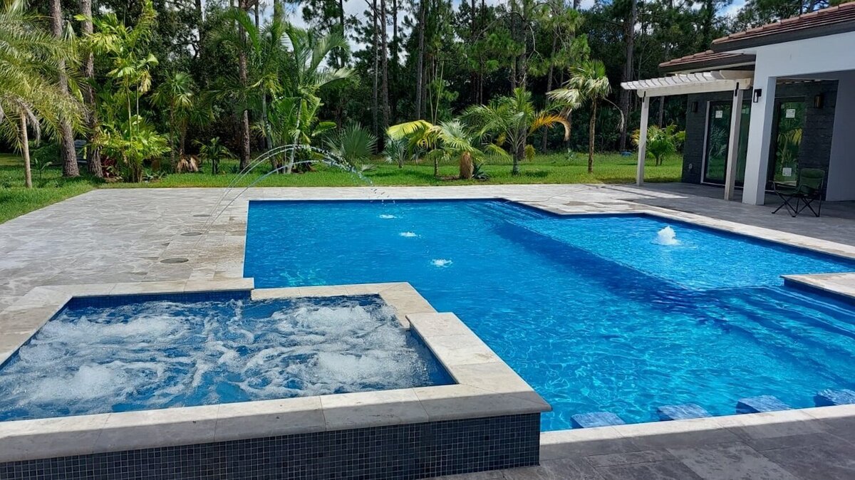 Swimming pool with spa and water features