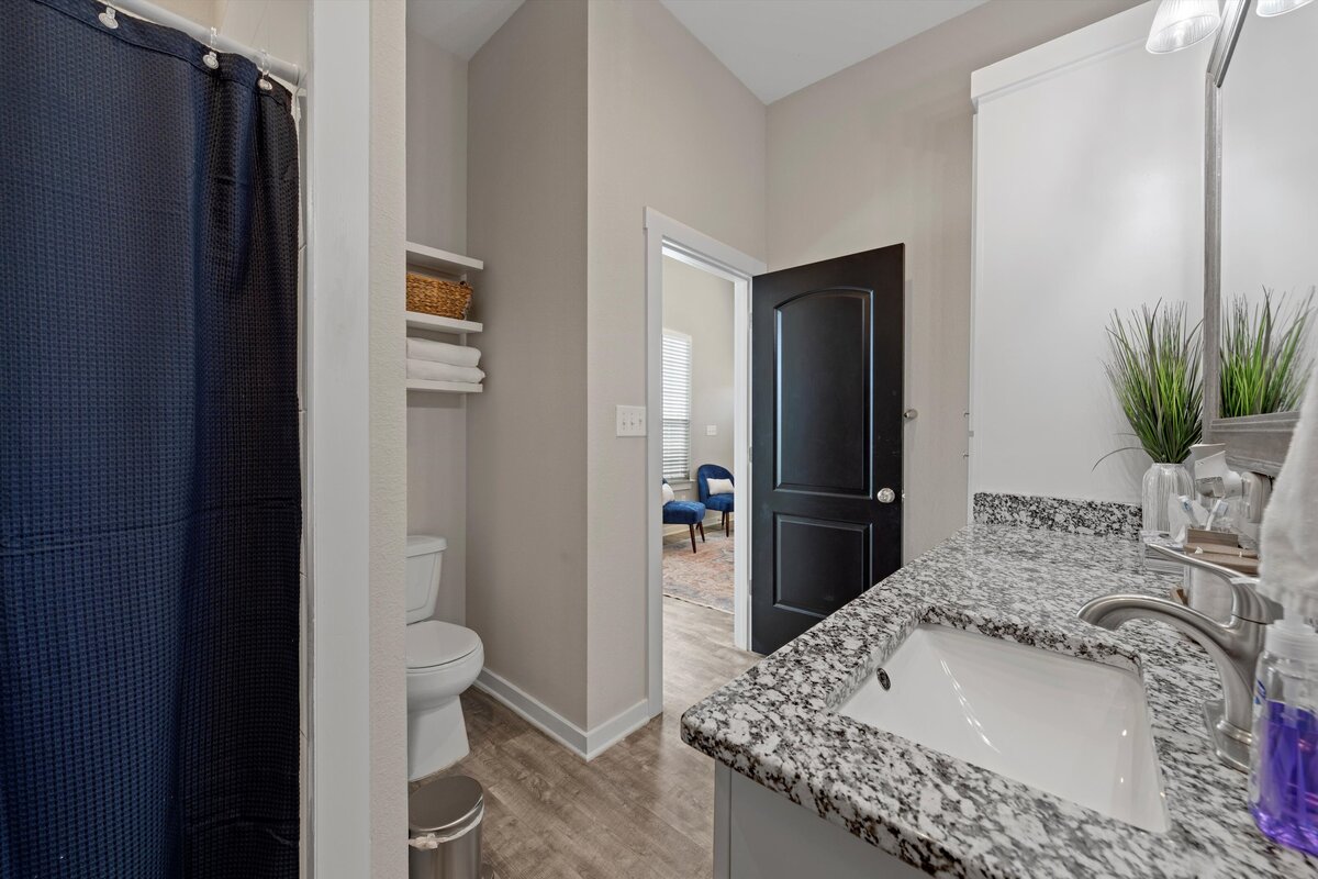 Bathroom with plenty of counter space and large vanity in this one-bedroom, one-bathroom vacation rental condo with free Wifi, free parking, and extra twin bed in downtown Waco, TX.