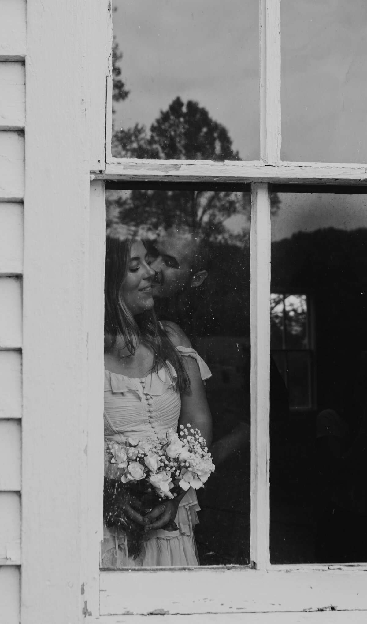 Black and white wedding kiss, classic Indiana wedding moment.