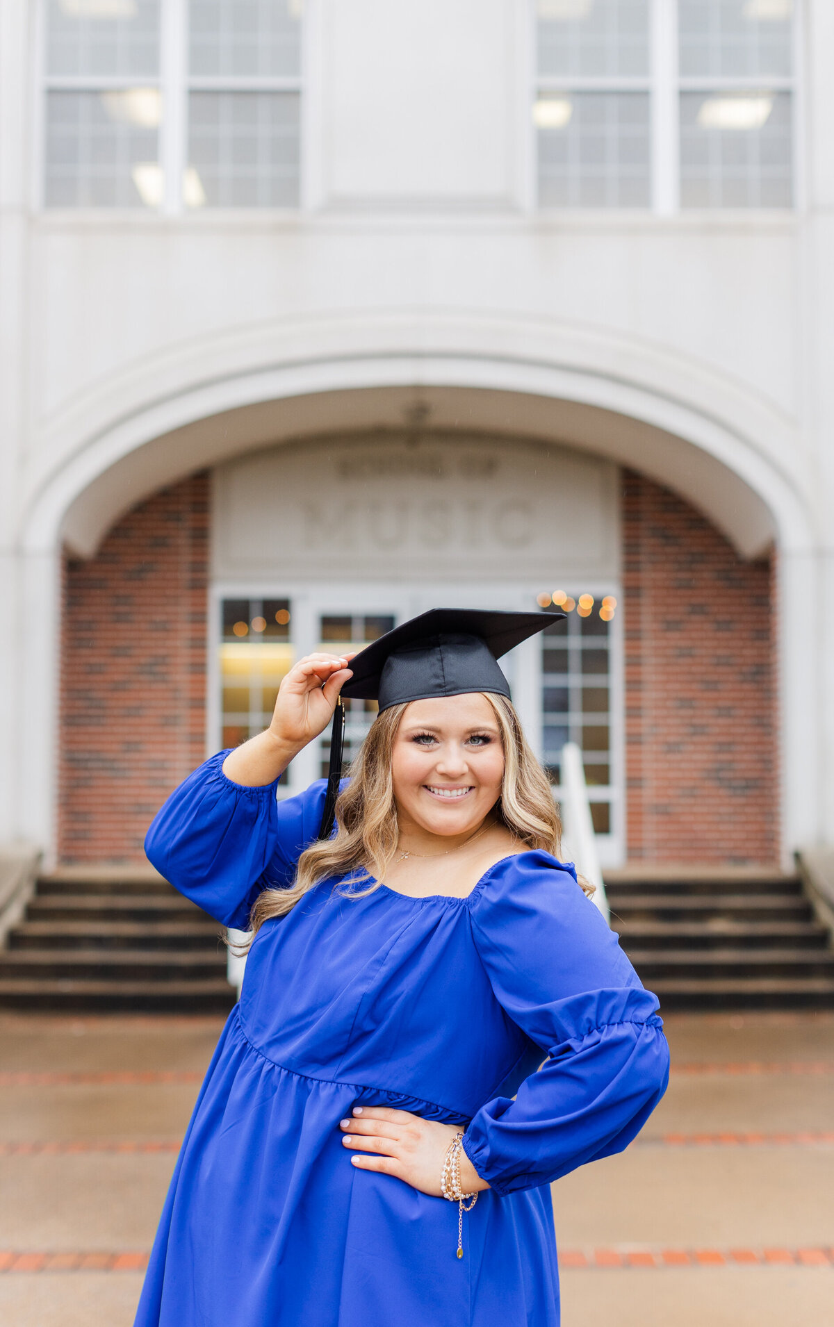 college senior posing with graduation cap at Lee University