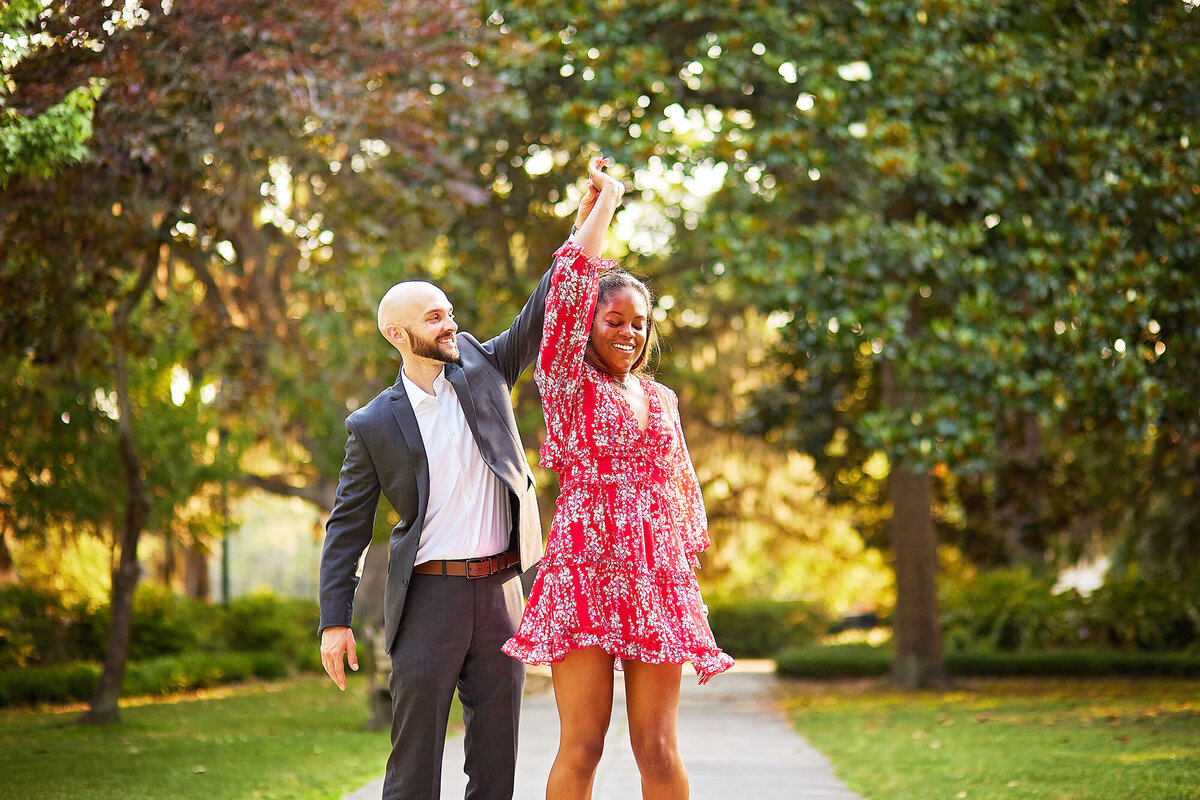 Forsyth Park Engagement session couple twirl Savannah Wedding Photographer