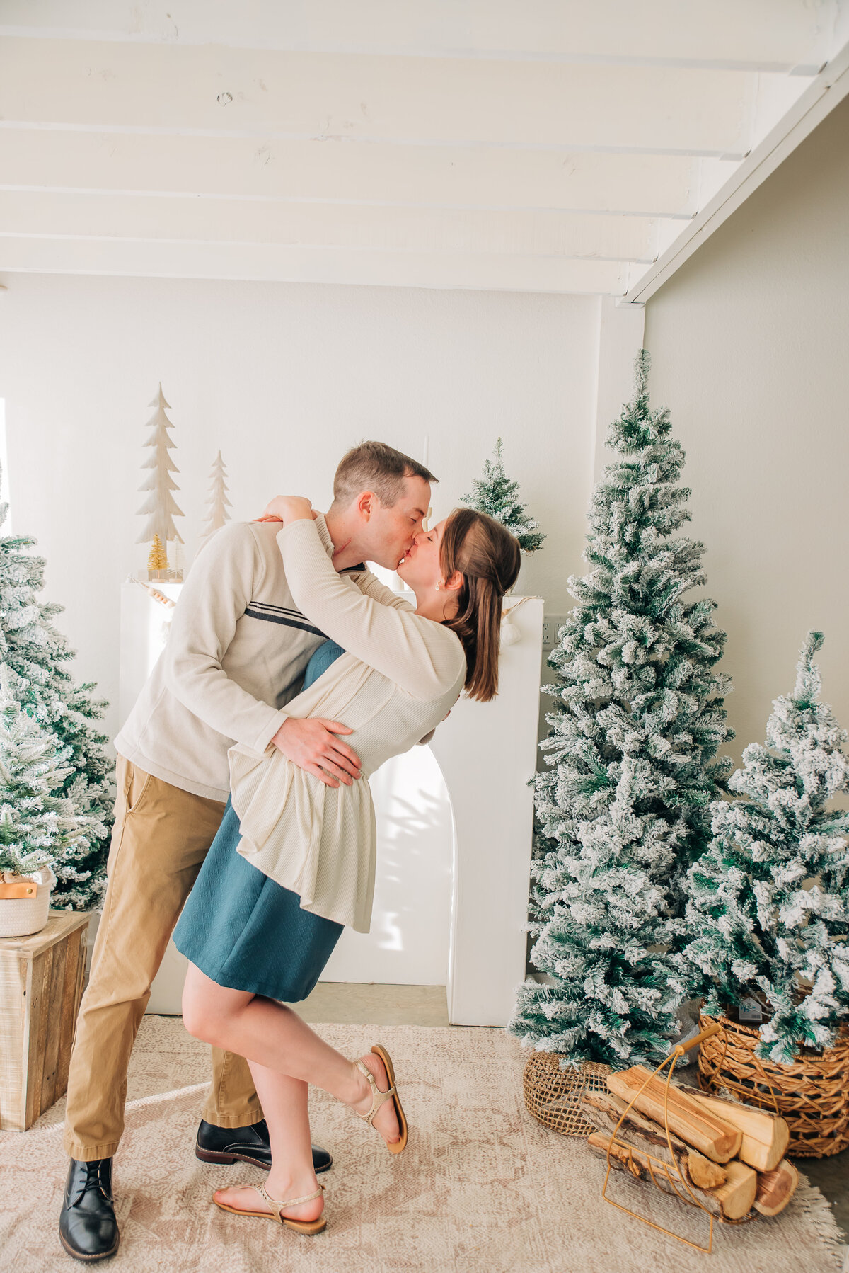 man and woman kissing together in a studio denver family photo session taken by colorado wedding photographers