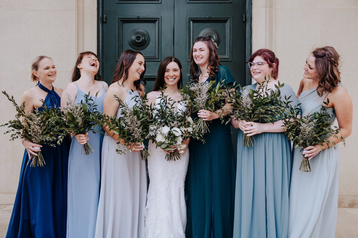 Nashville wedding photographer captures bridesmaids wearing blue bridesmaid dresses