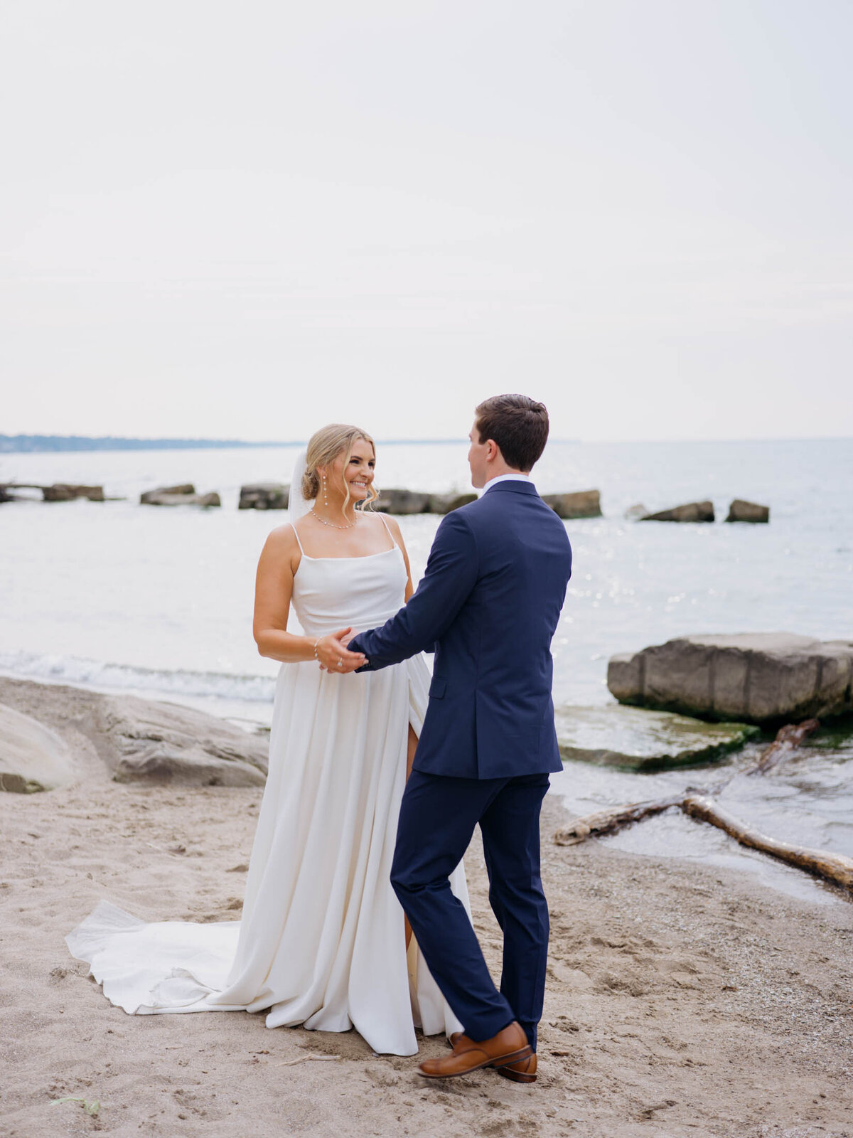 Bride and groom with lake in the background