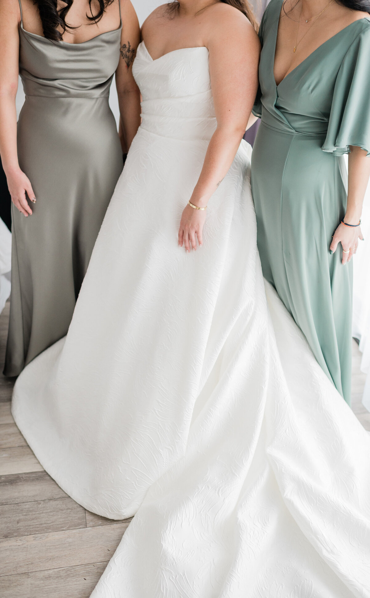 Bride stands with maid and matron of honor