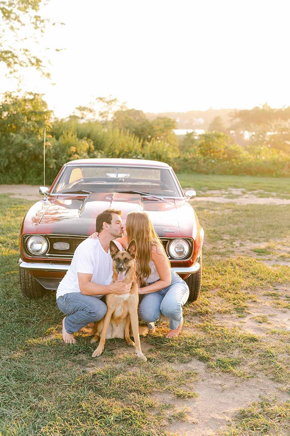 Couples session with dog and classic red muscle car