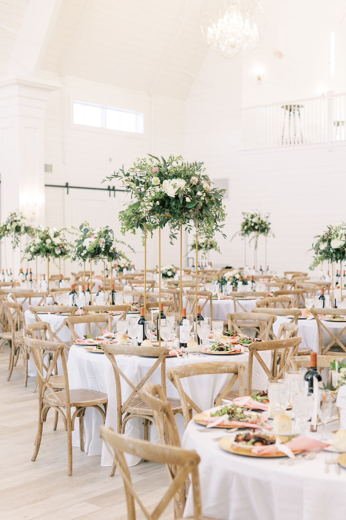 White barn wedding venue set up for a wedding reception