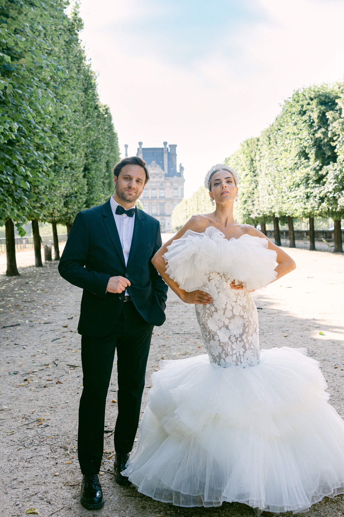 A wedding photo of a bride in her white dress in the streets of Paris in France.