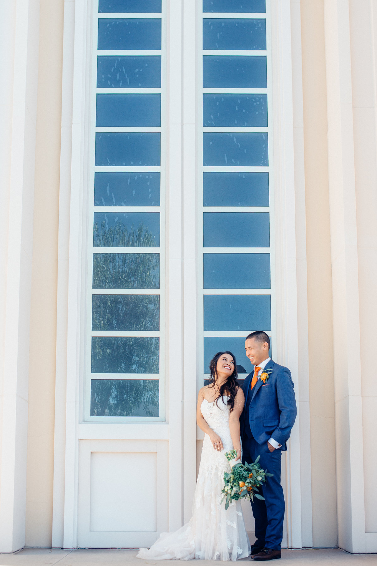 Wedding Photograph Of Bride And Groom Standing By The Window Los Angeles
