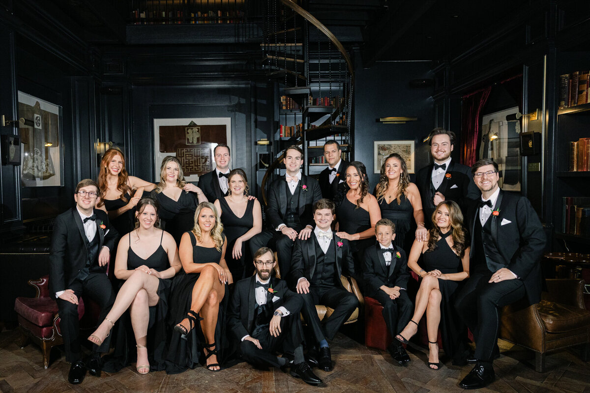 Wedding party portrait at the Library Bar during a same-sex wedding at the Swexan Hotel
