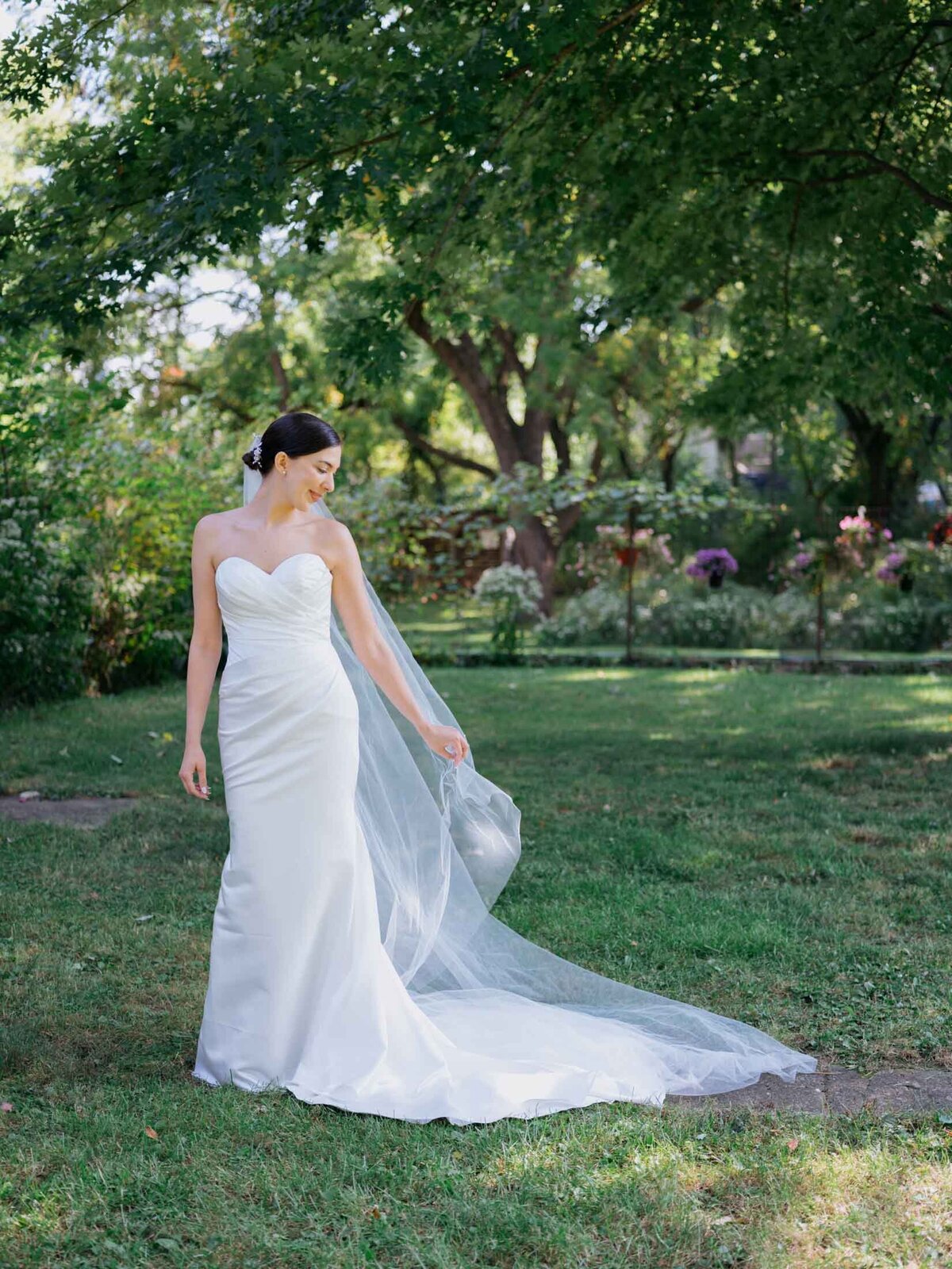 Bride in elegant Maggie Sottero gown at her backyard wedding