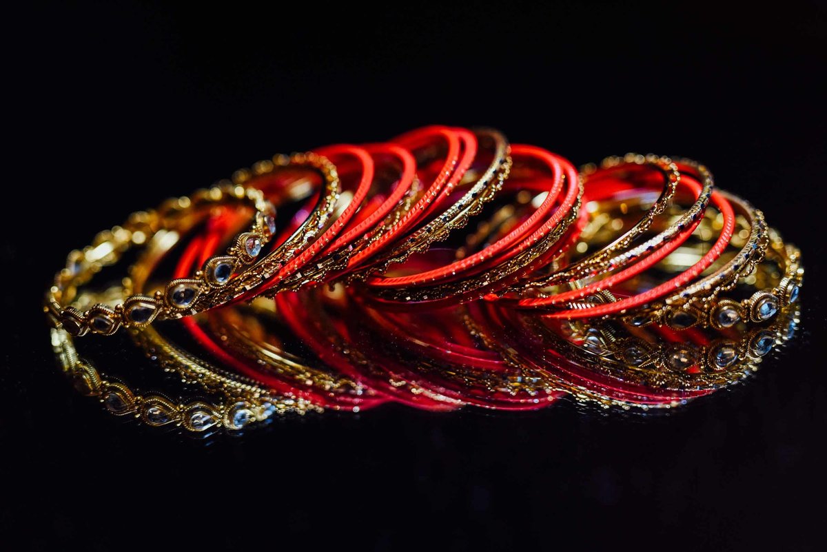 Indian wedding jewelry in reds and gold.
