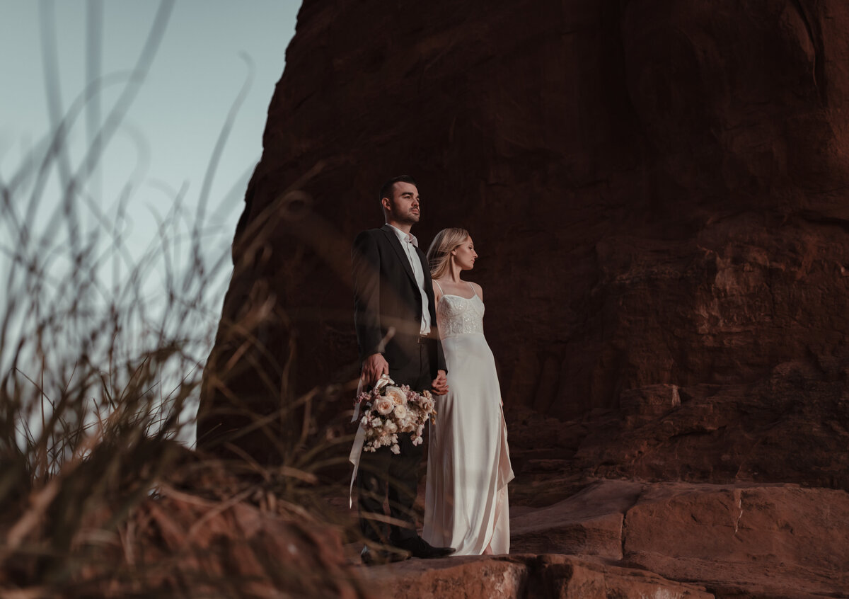 Wide shot of Cathedral Rock elopement couple at sunset taken by Kollar Photography