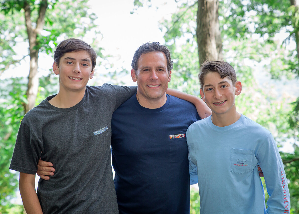 portrait of father and two teenage sons